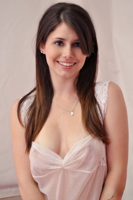Young amateur model exposes hr bare ass while teasing in shear lingerie