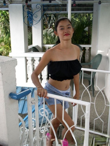Busty Filipina teen Alma Chua has sex with her man friend on a covered patio