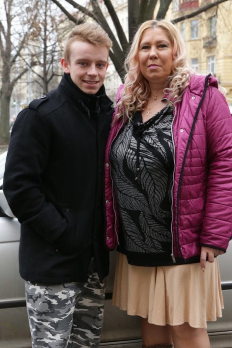 Horny older blonde seduces young boy with her massively huge big tits