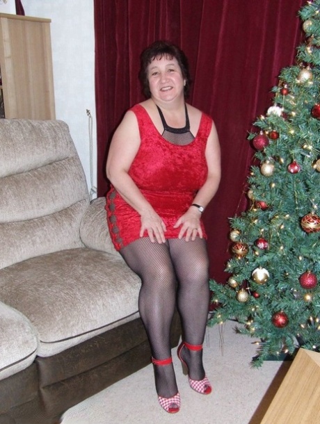 Thick aged lady Kinky Carol frees her huge tits from a crotchless bodystocking