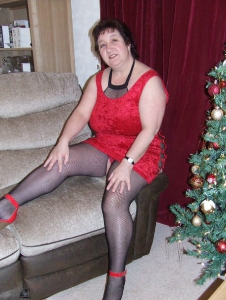 Thick aged lady Kinky Carol frees her huge tits from a crotchless bodystocking