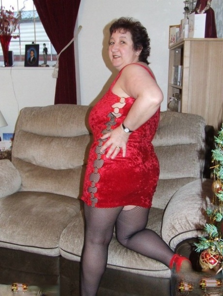 Thick aged lady Kinky Carol frees her huge tits from a crotchless bodystocking