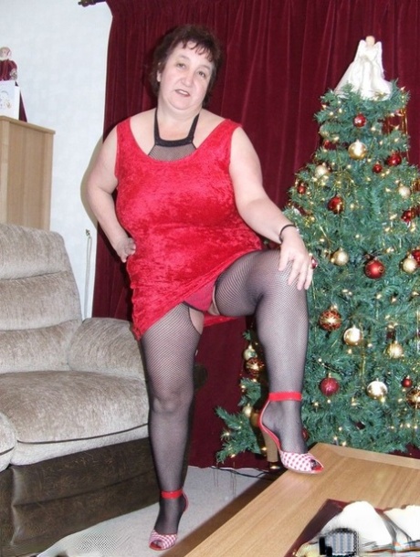 Thick aged lady Kinky Carol frees her huge tits from a crotchless bodystocking