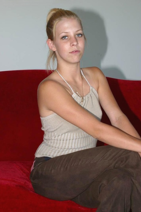 Leggy teen Leah stretches out her naked pussy during solo action