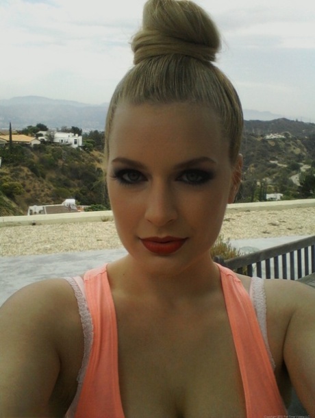 Big boobed amateur is joined by a girlfriend during one of her self shots