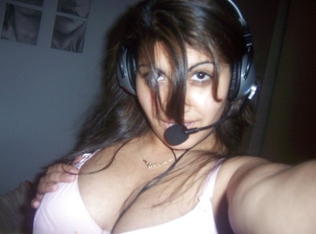 Indian girl removes her headset before taking selfies of her big tits