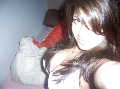 Indian girl removes her headset before taking selfies of her big tits