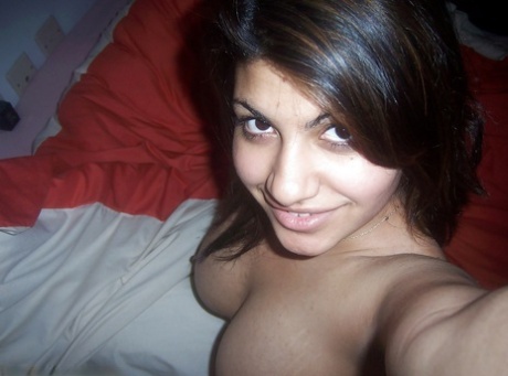 Indian girl removes her headset before taking selfies of her big tits