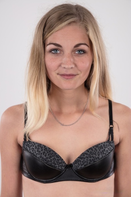 Blonde teen Marcela shows her very tiny tits wearing a black thong