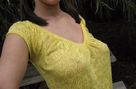 Teen amateur Mandy takes selfies of her firm tits and bald slit in a yard