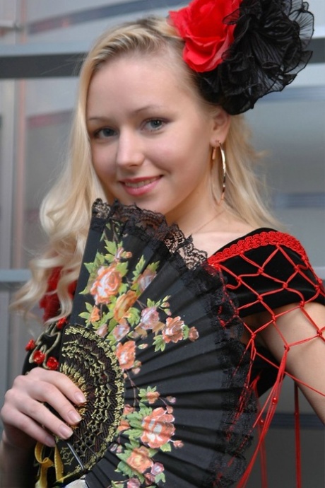 Cute blonde uncovers her great tits while removing a fancy dress