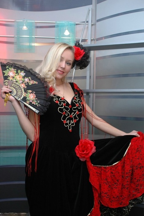 Cute blonde uncovers her great tits while removing a fancy dress