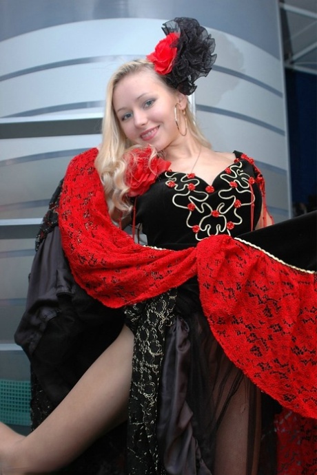 Cute blonde uncovers her great tits while removing a fancy dress