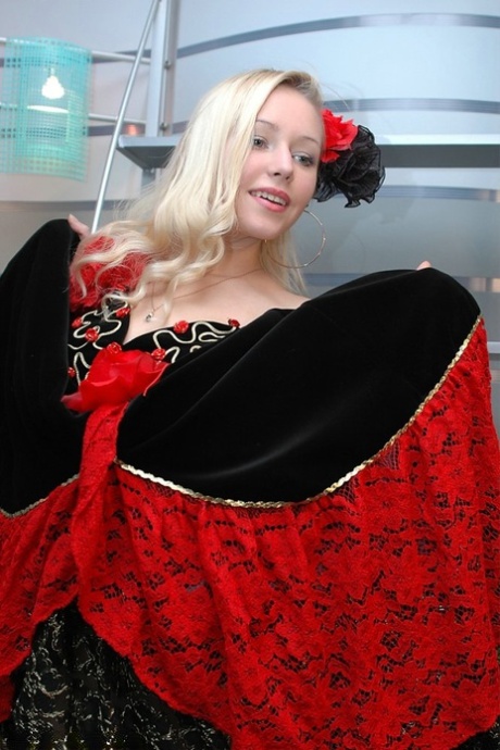 Cute blonde uncovers her great tits while removing a fancy dress