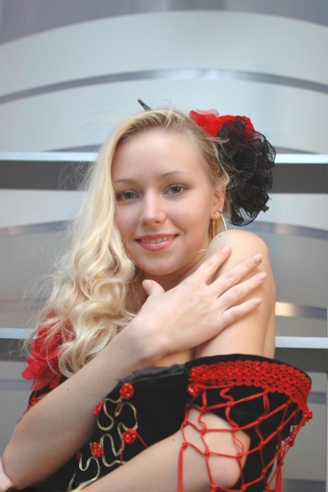 Cute blonde uncovers her great tits while removing a fancy dress