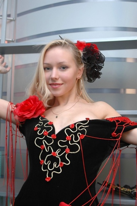 Cute blonde uncovers her great tits while removing a fancy dress