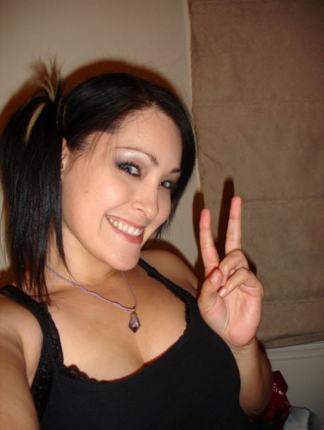 Asian solo girl takes selfies while getting naked in pigtails