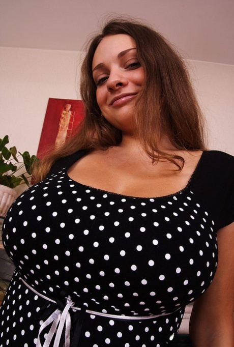 Big titted brunette gets completely naked during a solo engagement