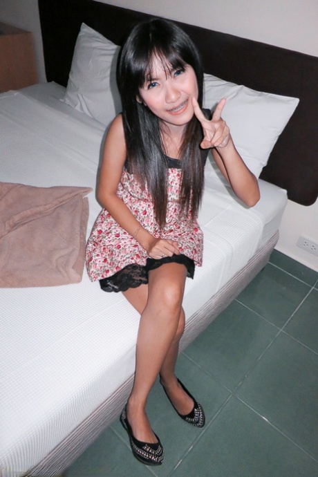 Busty Thai girl Beer gives up her shaved pussy to a sex tourist in hotel room