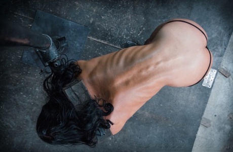 Brunette MILF London River has her asshole penetrated while in tight bondage