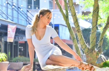 Amateur model Blake wears a tight dress while exposing herself in public