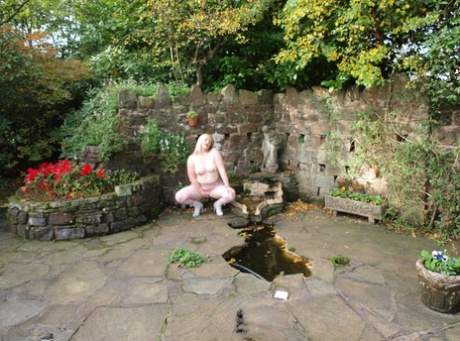 Blonde BBW Samantha unveils her tits and snatch while in a garden