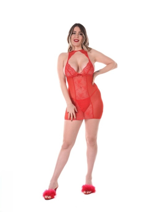 Curvy blonde Marica Chanelle discards red lingerie before toying her pussy