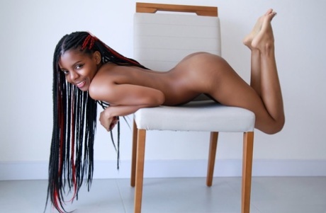 Hot black teen Sukki T models totally naked in a confident manner
