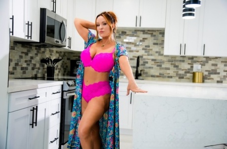 Middle-aged redhead Rachel Steele disrobes in a kitchen prior to POV fucking