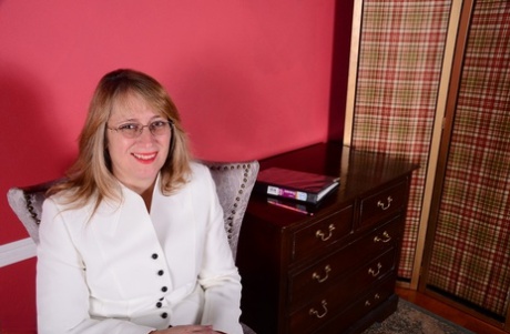 American businesswoman disrobes at the end of the day to masturbate