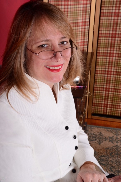 American businesswoman disrobes at the end of the day to masturbate