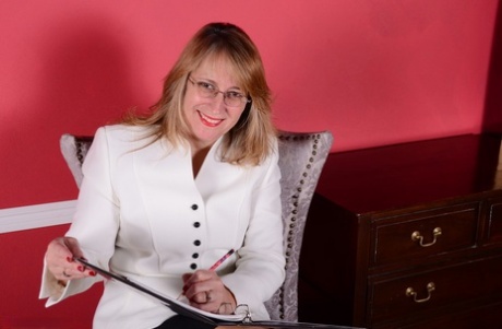 American businesswoman disrobes at the end of the day to masturbate