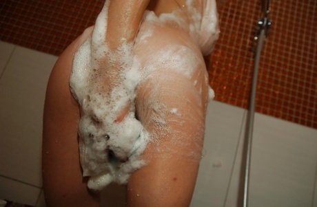 Big tit brunette milf Kazumi washing her awesome hairy pussy