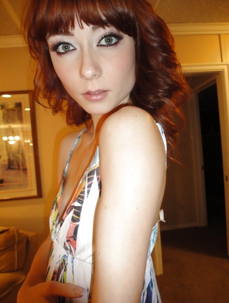 Slender redhead ex-gf Zoe Voss snaps self shots of herself getting undressed
