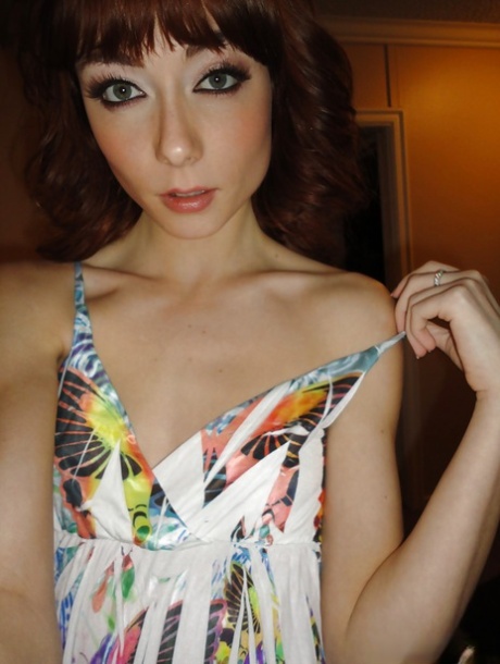 Slender redhead ex-gf Zoe Voss snaps self shots of herself getting undressed