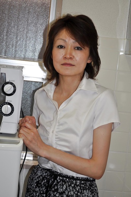 Shy mature asian lady Takako Kumagaya undressing and spreading her legs