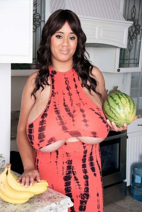 MILF Roxi Red shows off her giant melons that are much bigger than watermelons