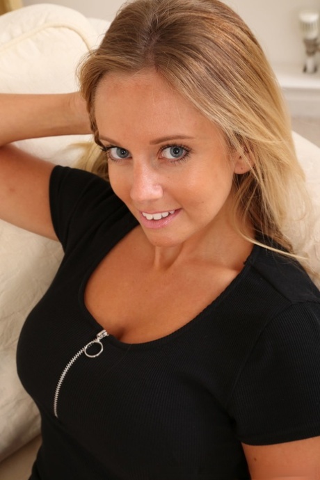 Big eyed nympho Suzi doffs her black dress and poses in transparent nylons