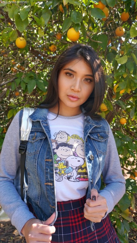 Hot Asian schoolgirl Brenna Sparks uncovers fake tits outside & flashes pussy