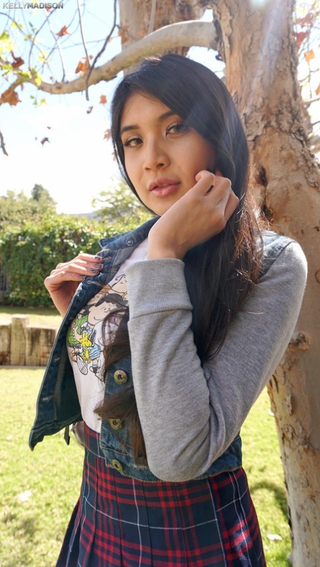 Hot Asian schoolgirl Brenna Sparks uncovers fake tits outside & flashes pussy