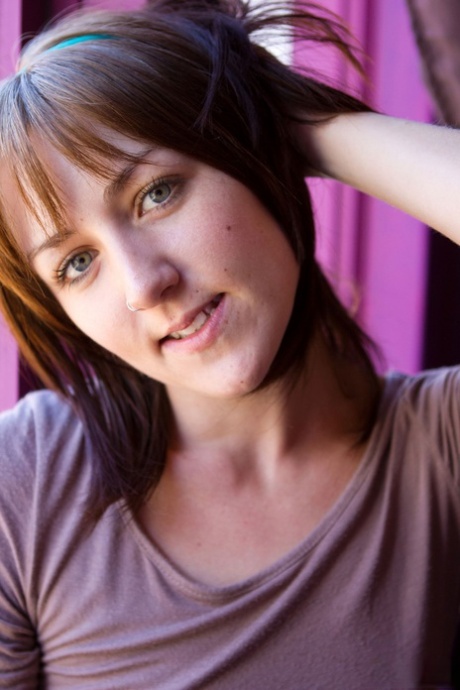 Cute brunette Keilyn removes her shirt and panties and poses naked