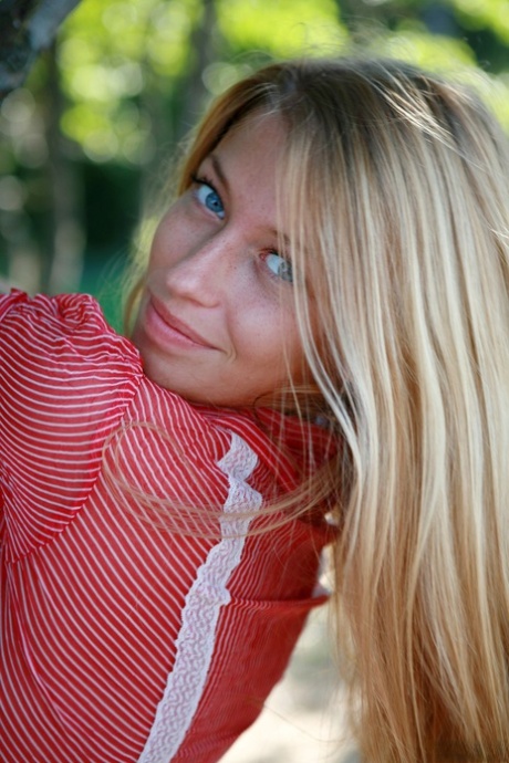Gorgeous blonde Yana P exposes her fantastic tits and poses on the beach