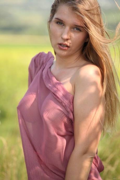 Lovely babe Beverly A removes her sheer dress and flaunts her big tits