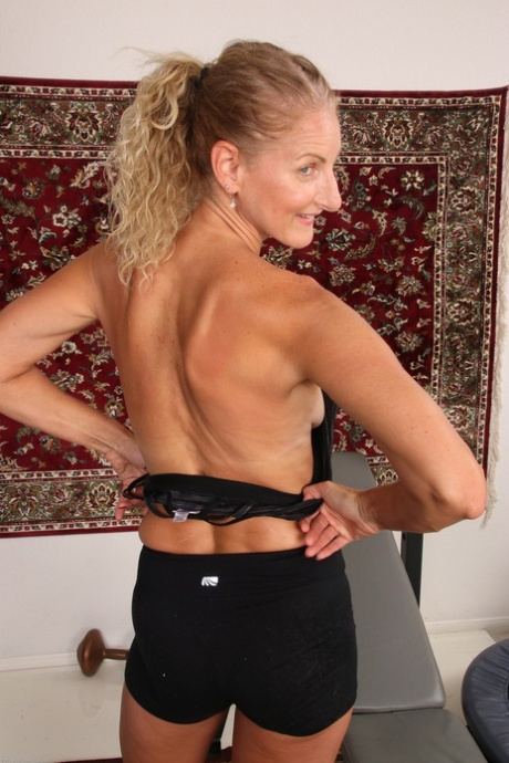 Fit mature blonde Layla Wolf strips & shows her hot body with tan lines