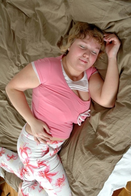 Chubby short-haired doll Jennifer strips to show her massive natural boobs