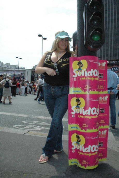 Blonde BBW Leah Jayne exposes her big natural tits in public during a riot