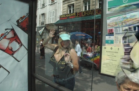Blonde BBW Leah Jayne exposes her big natural tits in public during a riot