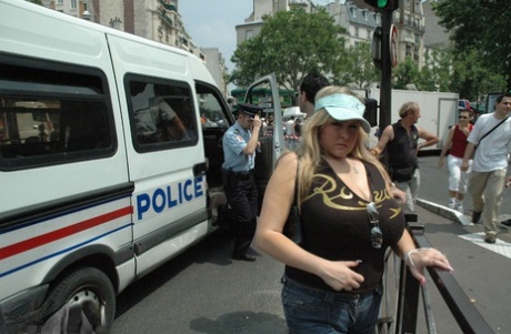 Blonde BBW Leah Jayne exposes her big natural tits in public during a riot