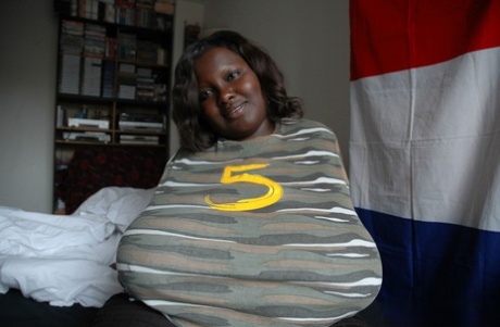 Fat black woman Mariana Kodjo showing off her extra-large natural tits