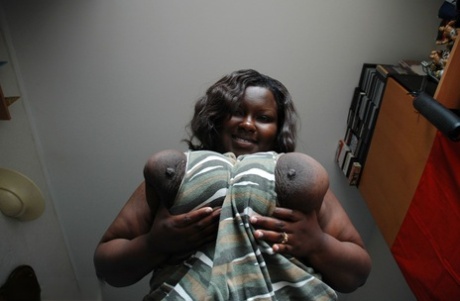 Fat black woman Mariana Kodjo showing off her extra-large natural tits